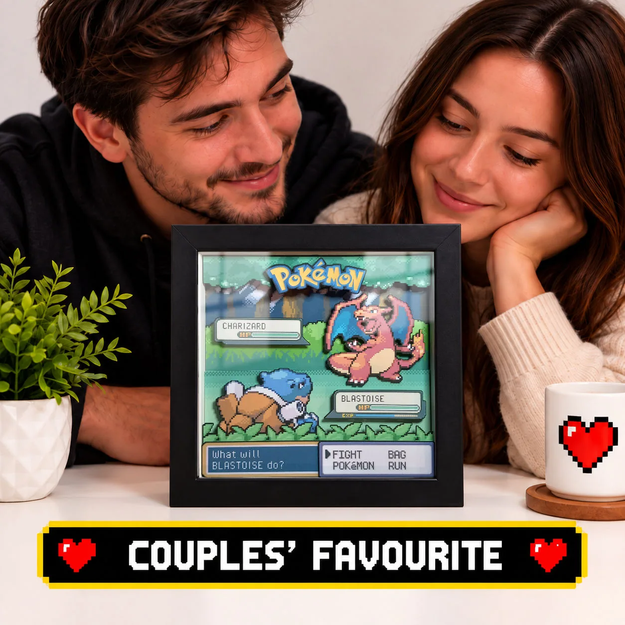 Couple with a personalised Pokémon battle shadow box designed as an anniversary or Valentine’s Day gaming gift.