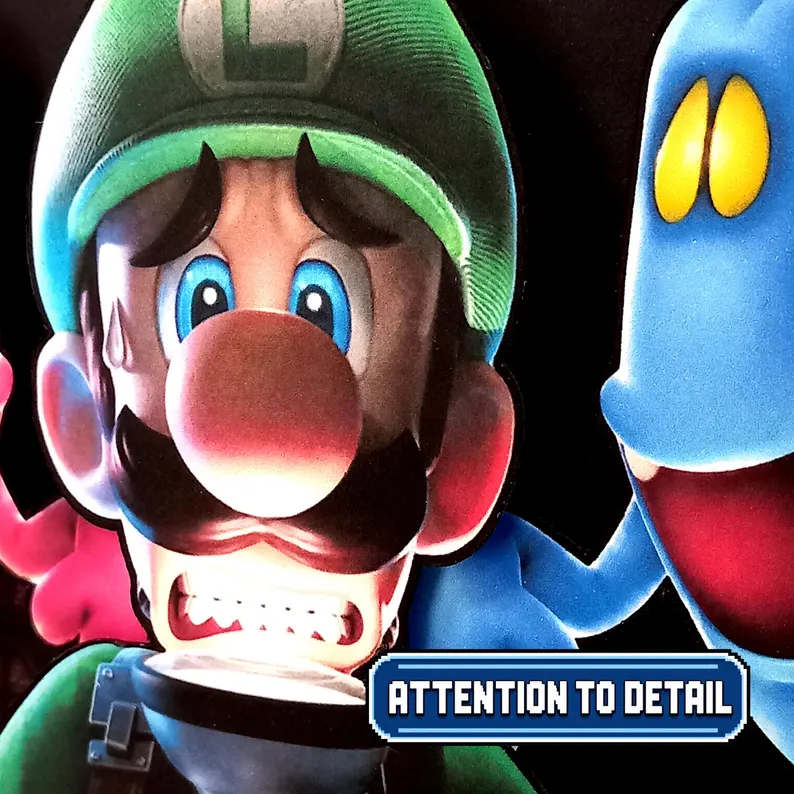 Detailed close-up of Luigi holding the Poltergust beside a blue ghost, showing the printed and cut cardstock layers.