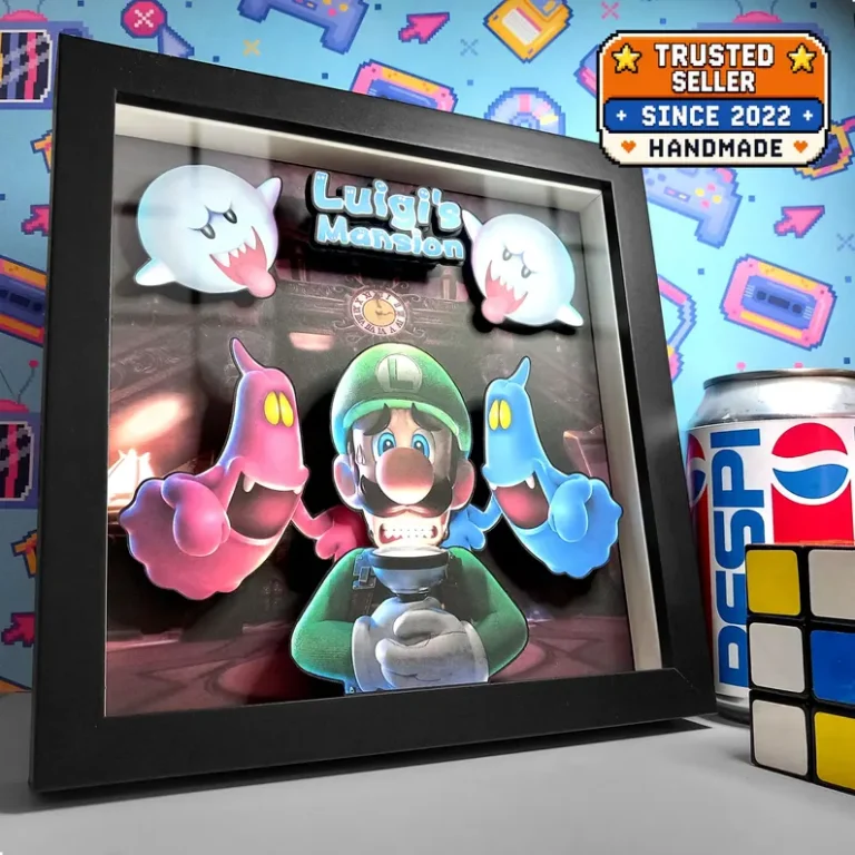 Black framed Luigi's Mansion layered shadow box featuring Luigi with his Poltergust, colourful ghosts, Boos and the game logo.